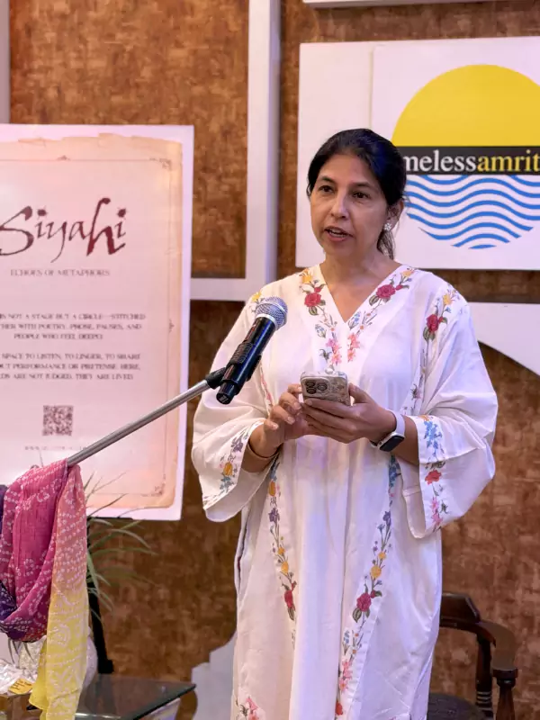 Woman sharing a story or poem on stage during Siyahi’s Aunty Please literary event in Amritsar