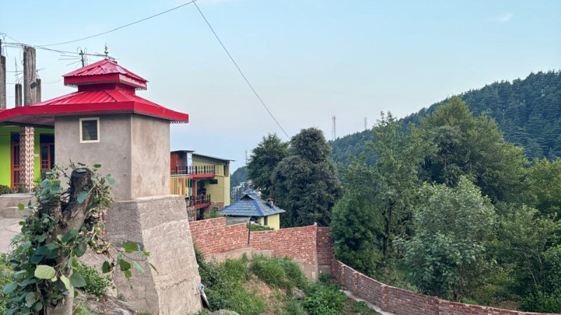 Scenic view of Dharamkot village in India, surrounded by mountains and greenery — Siyahi Blog Post